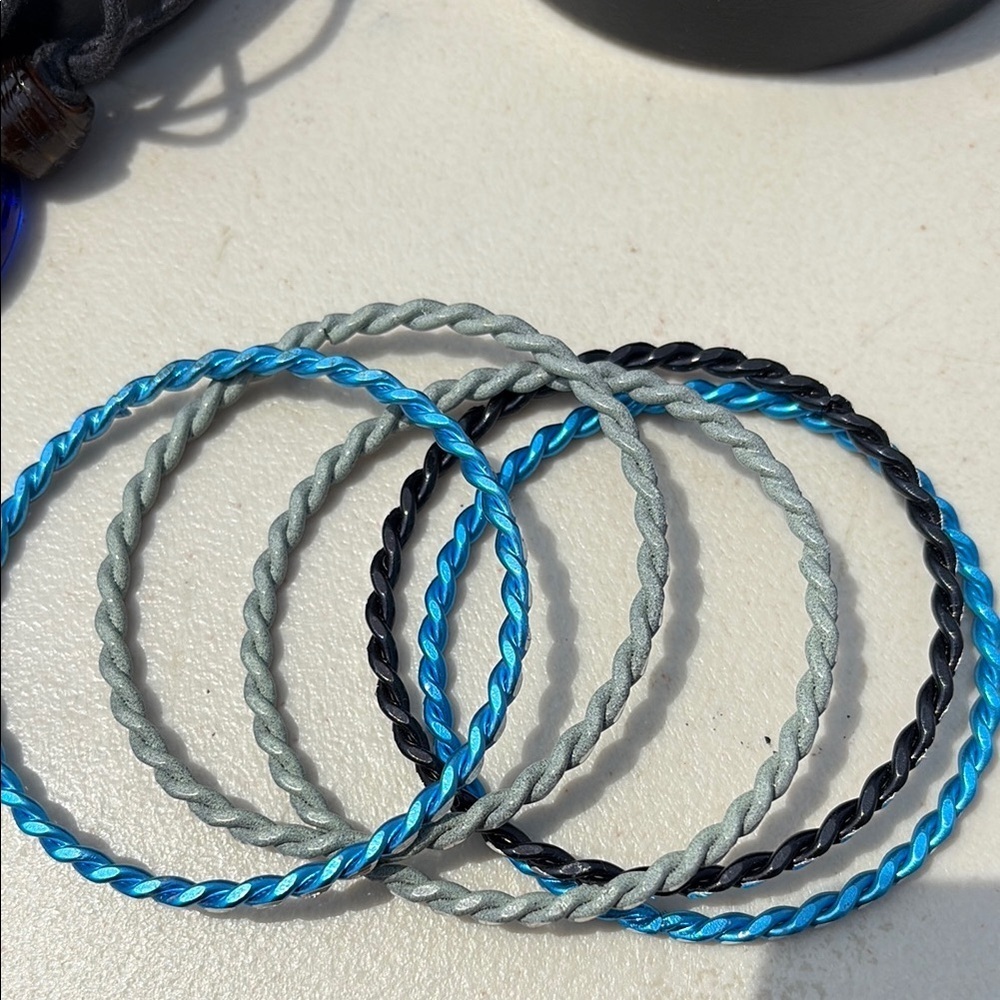 4/$20 Set of Twisted Bangles in Blue, Gray, and Black